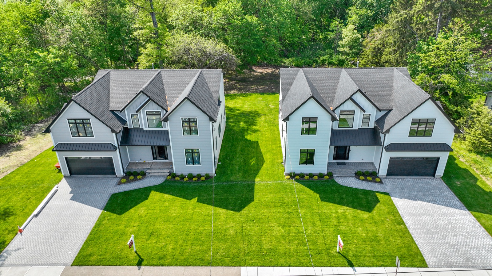 Aerial view of side-by-side luxury craftsman residences in Northern New Jersey