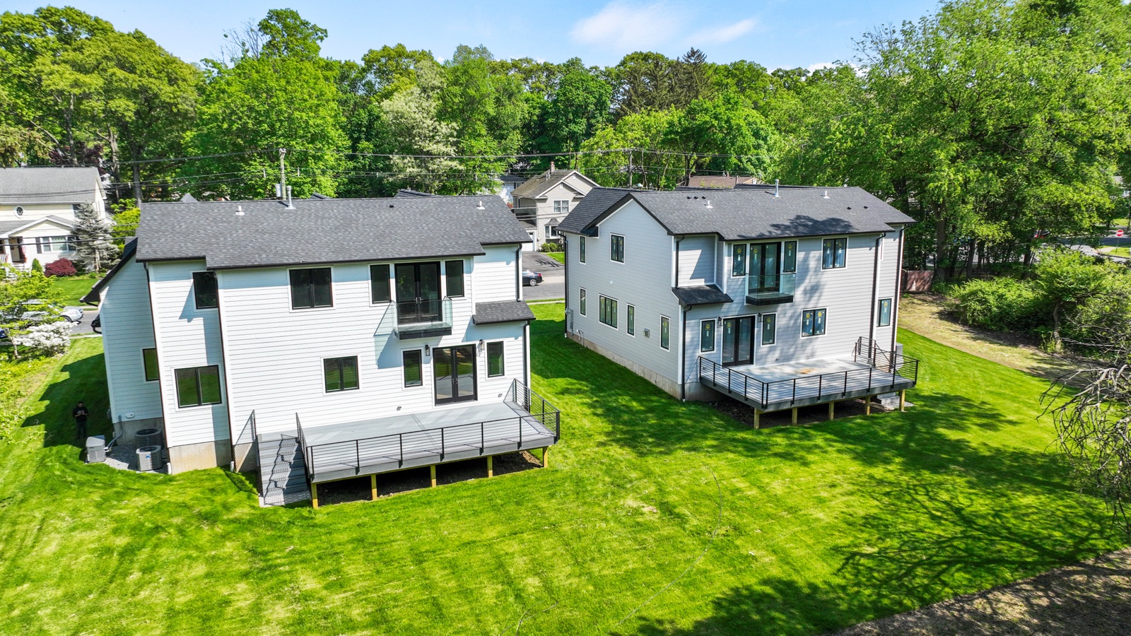 Rear elevation of new-construction homes by Rock Capital Partners